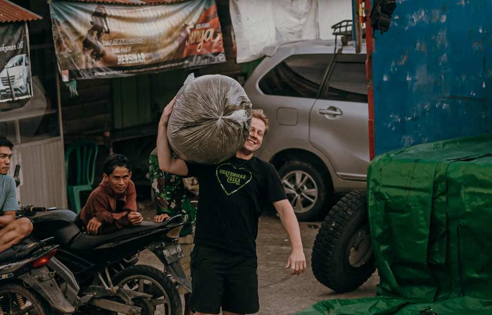 Owner Ondřej Tanistra, carrying a fresh batch of kratom in Indonesia